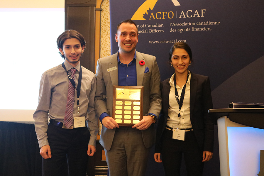 ACFO-ACAF President Dany Richard stands with two past scholarship winners