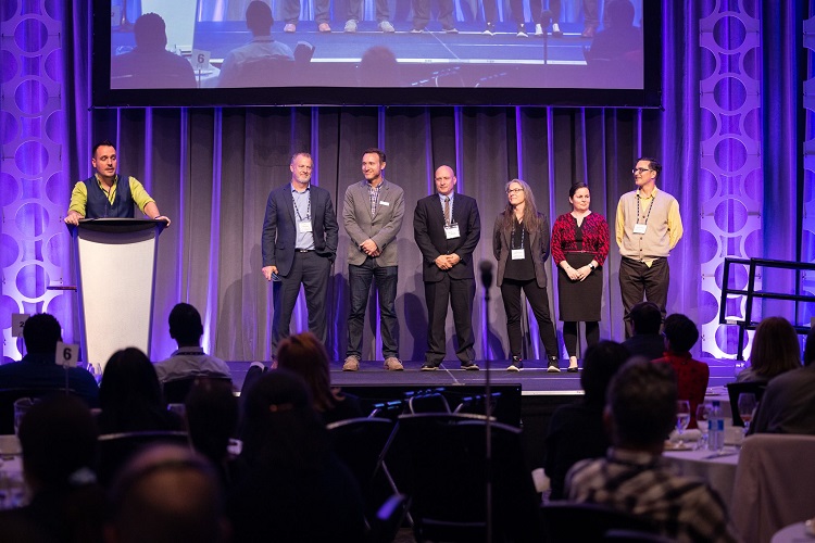 AGM Board of Directors standing on stage